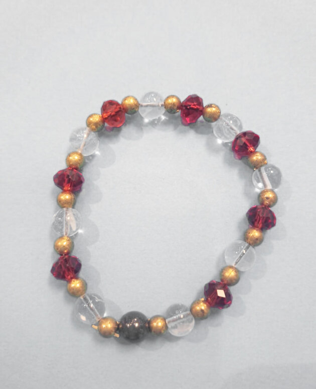 One hematite with clear and red beads and gold spacers