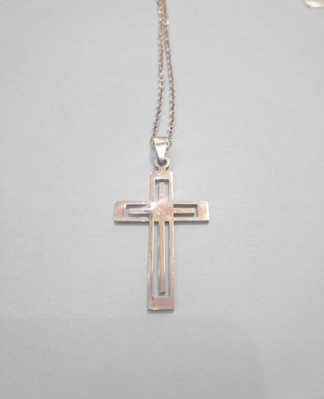 Stainless steel silver cross with cutout detail
